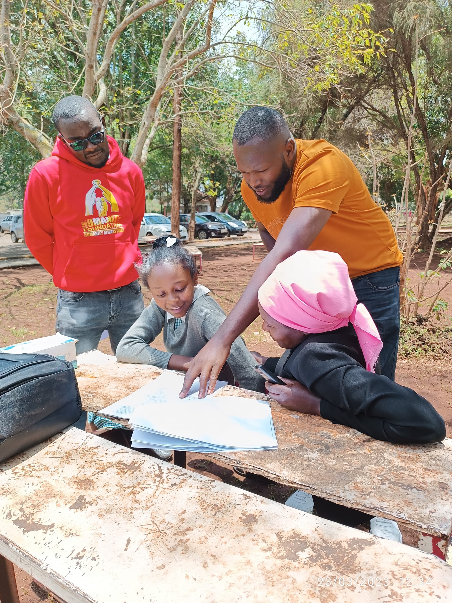 Helping her fill in the admission details