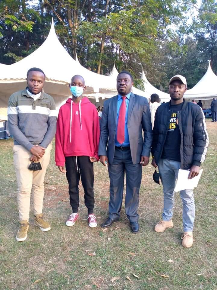 Kelvin with the Kiambu Highschool deputy headteacher and some of our volunteers during his admission.