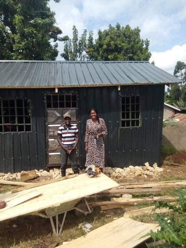 Boma Mabati director and Fundi George, she is the one who ensured that Boma Mabati company donated all iron sheets used in the construction of the Grandmother's house